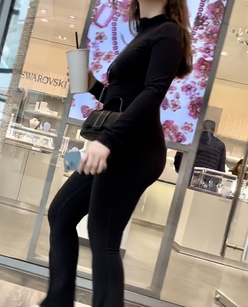 Brunette with glasses in leggings at the sports store #2uD64SIr