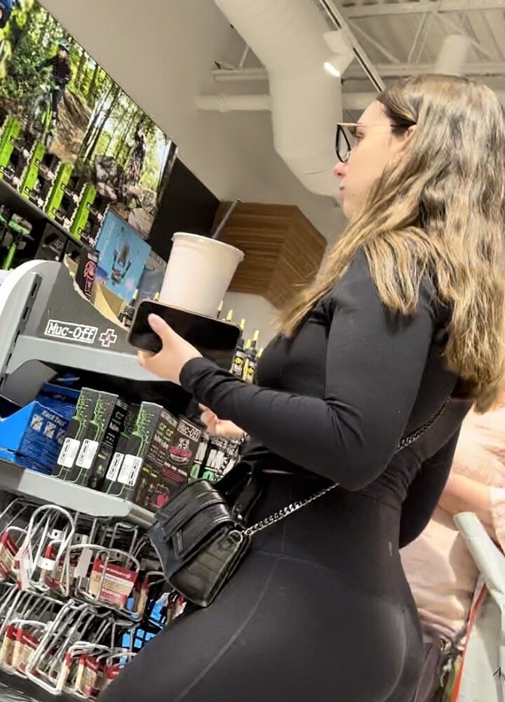Brunette with glasses in leggings at the sports store #7mGySRsO