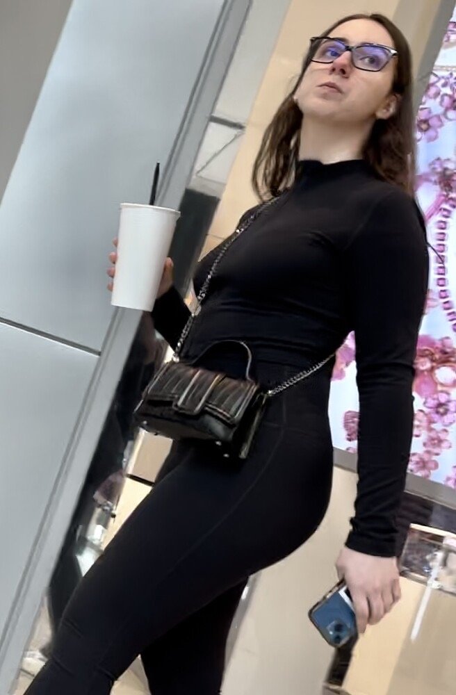 Brunette with glasses in leggings at the sports store #qDDKR55D